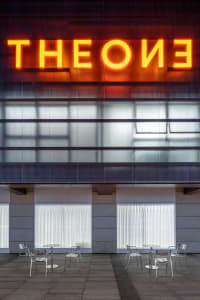 A modern architectural design featuring glass elements.
