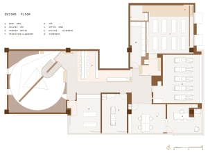Floor plan of an open-concept office space on the second floor, featuring large windows and an open layout.