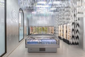 An image of a minimalist retail storefront with metallic textures.
