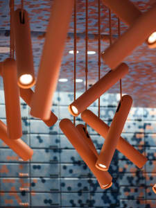 Close-up of modern industrial lighting fixtures in a contemporary setting.