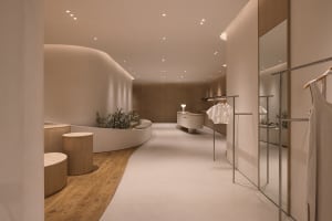 A modern retail storefront with natural materials such as wood and stone.