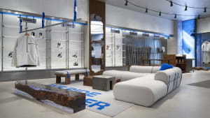Modern retail interior displaying sportswear and accessories in a sleek, minimalist design.