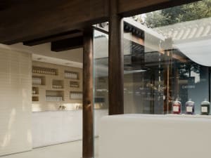 Modern retail storefront featuring polished wood and glass elements.