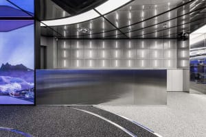 Minimalist, industrial-style office reception desk made of metal with a sleek, contemporary design.