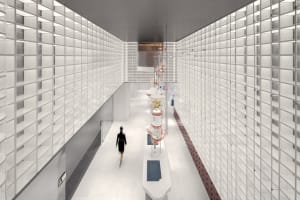 A modern corridor with glass-tiled walls and ceiling lights.
