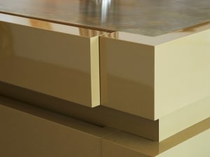 Close-up view of a minimalist interior design with metallic finish.