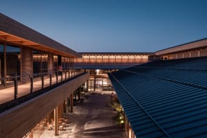 A modern commercial space features polished steel and wooden finishes.