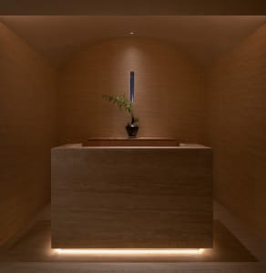 A photo of a modern reception desk made of marble.