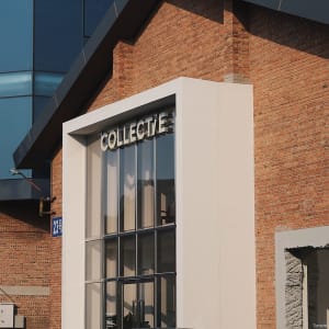 Modern urban office space with brick, concrete, and glass materials.