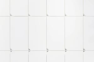 A modern calendar with a white paper design and a grid layout.
