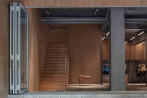 A modern retail storefront featuring wooden materials and a minimalist design.