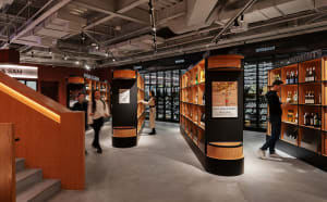Modern, sleek wine shelf with a variety of bottles in a commercial setting.