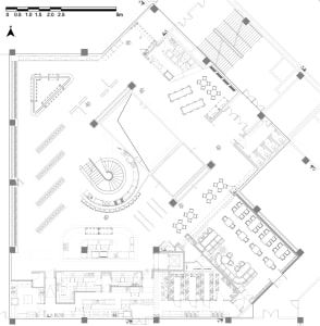Floor plan of an office space featuring modern materials like steel, glass, and concrete.