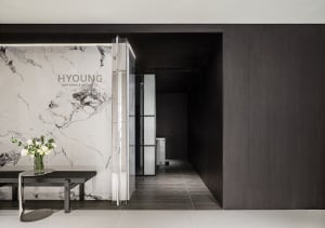 A modern spa entry featuring marble and steel materials.