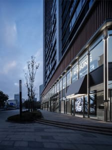 Modern office building with glass and concrete exterior.