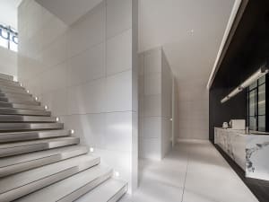 Modern office space featuring a combination of marble and concrete materials.
