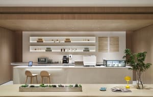 Modern cafe with concrete and wood finishes, featuring a minimalist bar counter with shelves and a table with a plant and boo