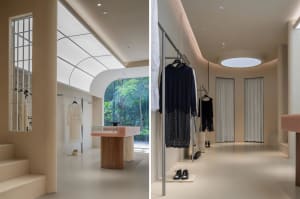 An image showcasing a modern retail shop with minimalist design elements, featuring concrete walls and floors.