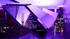 A modern installation featuring black glass and metal surfaces.