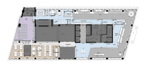 A detailed 2D architectural drawing of a modern office space with various rooms and functional zones.