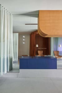 A modern office space featuring sleek interiors and contemporary furniture.