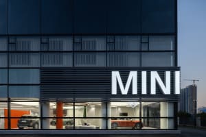 Modern building exterior with glass and metal facade, featuring a contemporary architectural design.