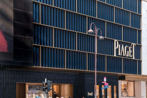 Modern storefront with metal, glass, and stone materials