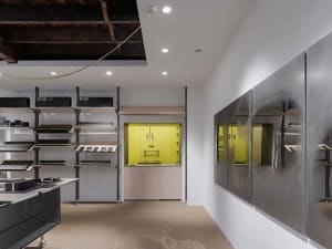 Modern storefront with black shelves, yellow accents, and metal cabinets.