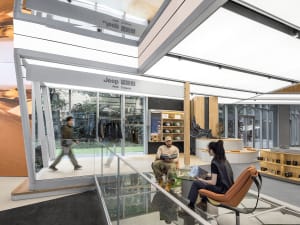 A sleek, modern storefront with metal exterior and glass doors.