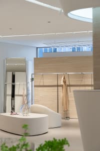A modern retail display featuring neutral colors and minimalist design.