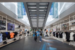 A spacious, modern commercial interior with concrete finishes.