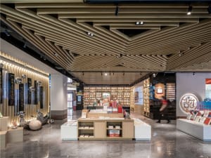 A modern bookstore interior designed with wooden elements and displays