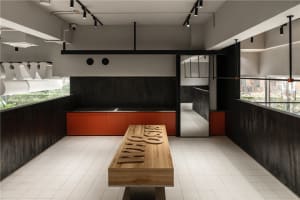 Modern coffee shop with wooden panels and concrete floor