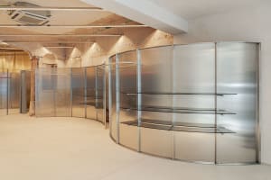 Modern retail storefront featuring glass and metal materials