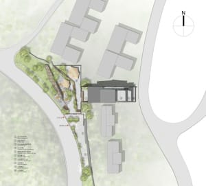 A technical 2D drawing of a building site with labels for various elements such as parking, terraces, and entrances.