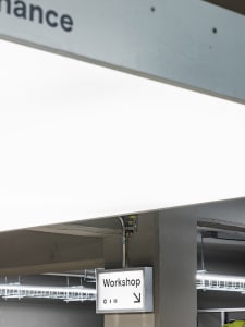 Interior design of an industrial-style workspace featuring modern lighting solutions.