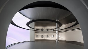 A modern interior design featuring a glass wall