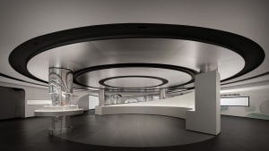 Modern retail space featuring metallic, concrete, and glass materials