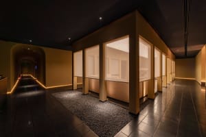 A modern spa interior with glass and marble elements.