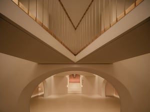 Concrete staircase intersection with minimalist design and clean lines.