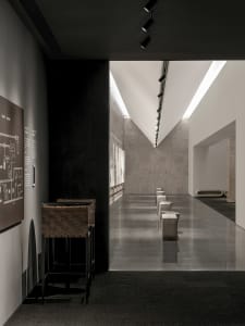 Modern, minimalist corridor made of concrete with sleek, clean lines.