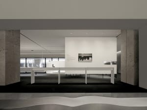 Modern minimalist exhibition space with concrete elements and clean lines.