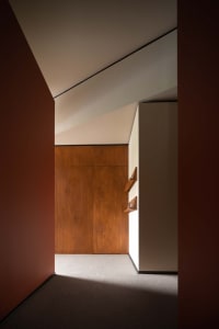 Modern interior design featuring a wooden wall and minimalist decor.