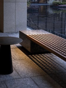 Concrete and wooden bench with granite texture in an outdoor space