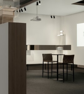 Modern coffee shop with a high-top counter and contemporary design elements.