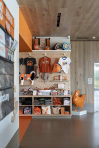 Retail storefront with grooming supplies on shelves and hanging display