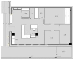 Minimalist residential floor plan with bedrooms, kitchen, and storage areas.