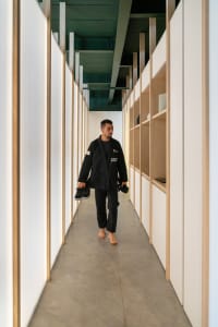 A minimalist design featuring exposed concrete walls and floor in an architectural interior space.