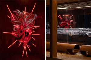 Modern interior design featuring metallic structures and neon lights.