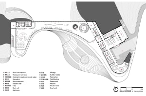Schematic of an office space with white walls, black furnishings, and red text annotations.